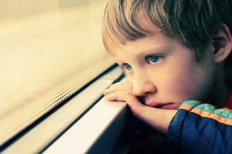 boy looking at the window