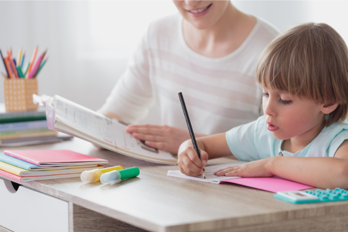 pupil studying with parent at home